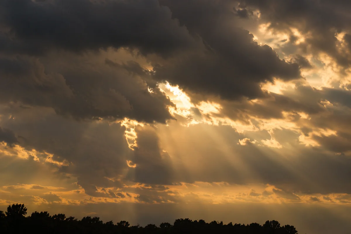 Sun Rays Breaking Through Storm Clouds