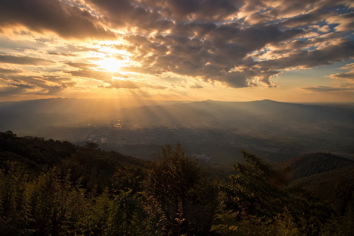 Sun Rays Breaking Through Golden Clouds