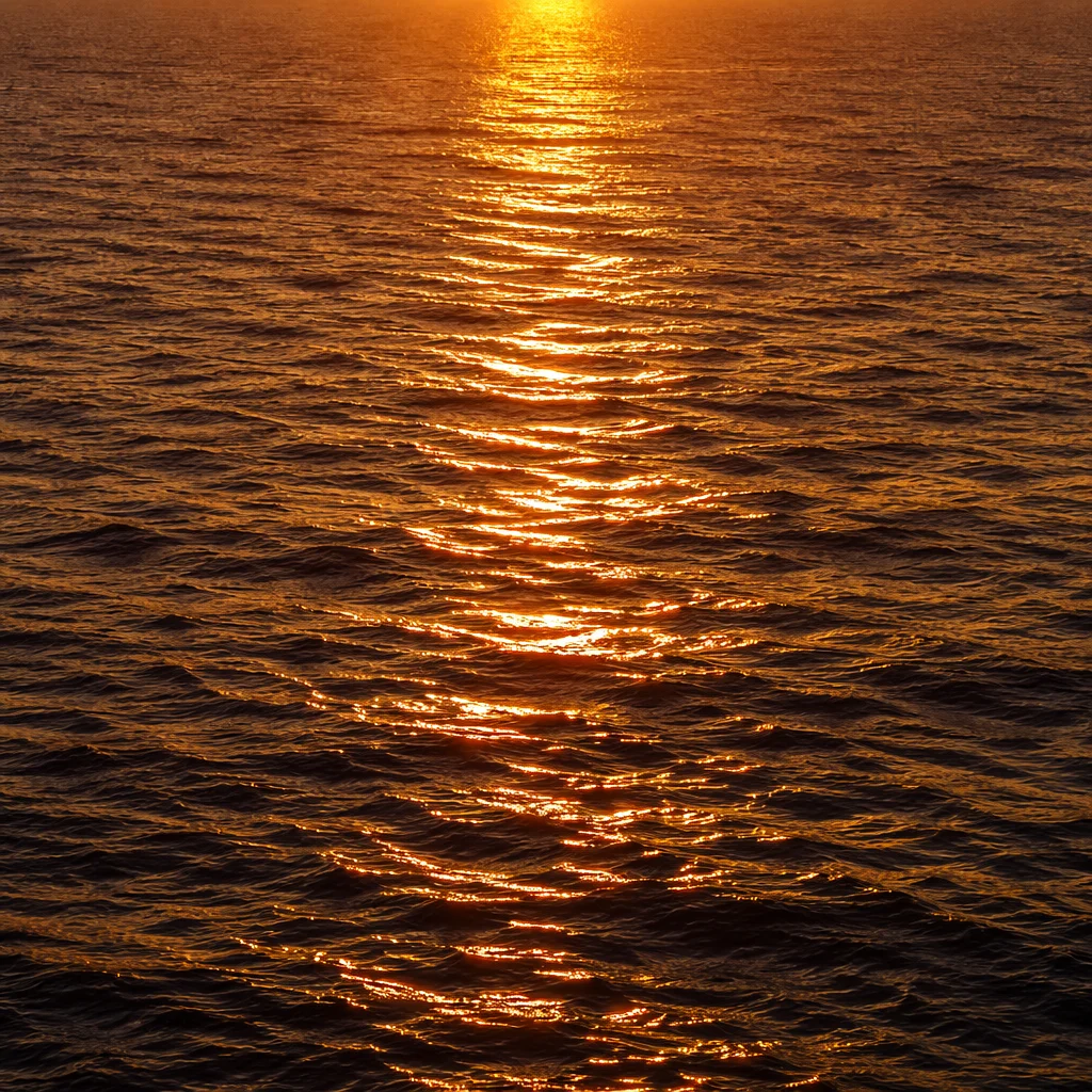 Golden Sunset Reflections on Calm Ocean