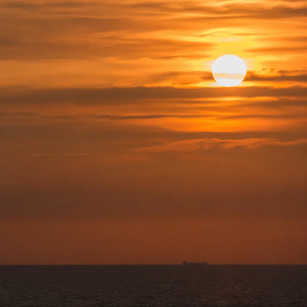 Golden Sunset Over Calm Ocean Horizon