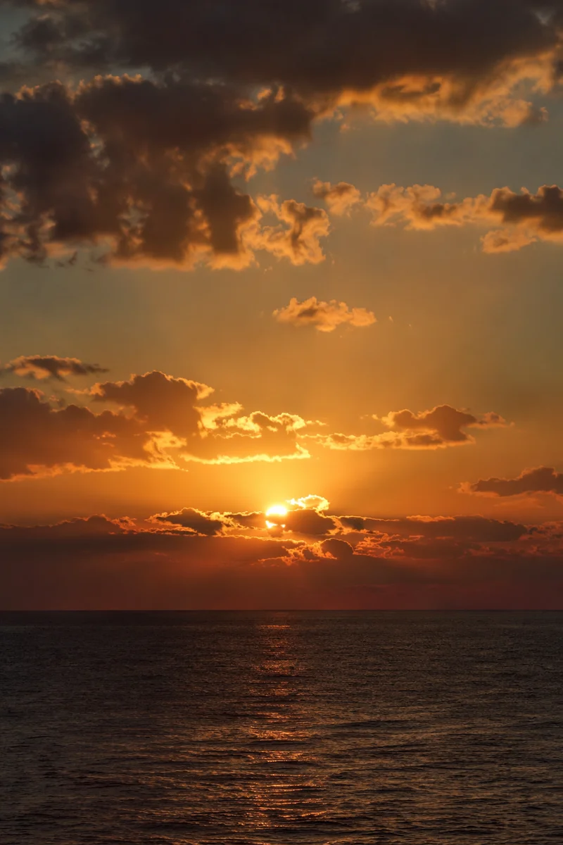 Golden Sunset Over Calm Ocean Horizon
