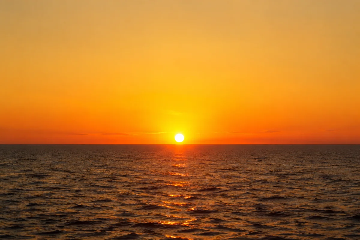 Golden Sunset Over Calm Ocean Horizon