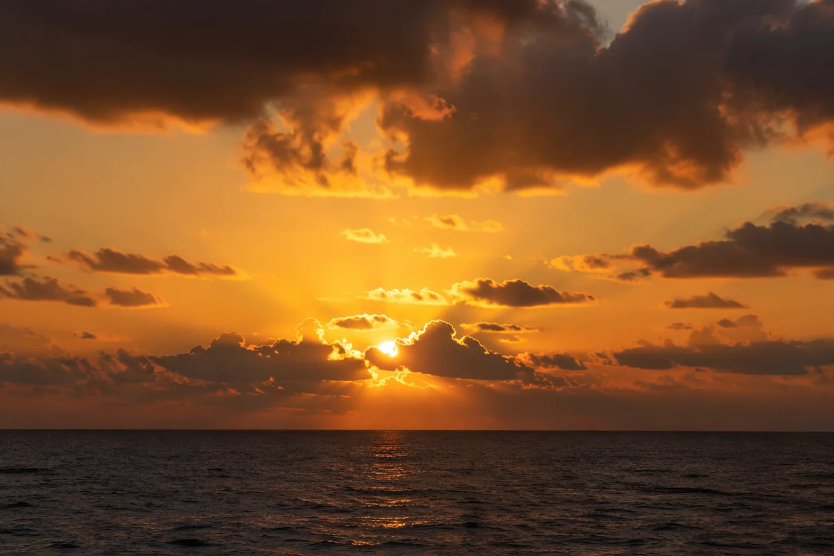 Golden Sunset Over Calm Ocean Horizon