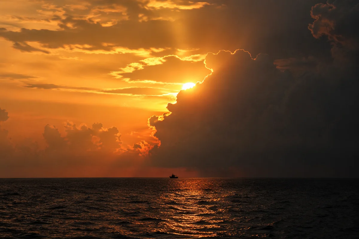 Golden Sunset Ocean Horizon with Storm Clouds