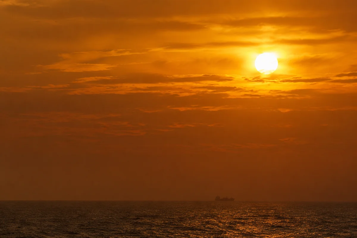 Golden Sunset Ocean Horizon With Cargo Silhouette