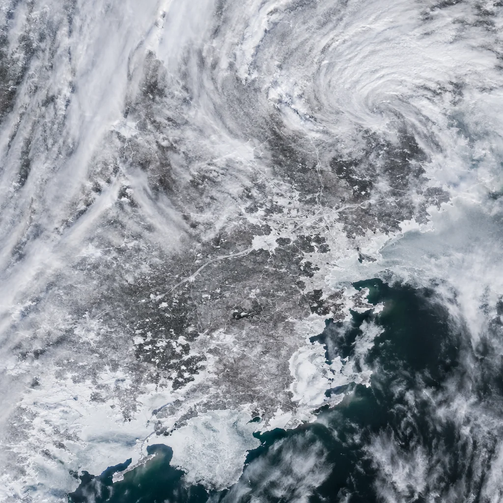Blizzard Over Frozen Coastal Winter Roads