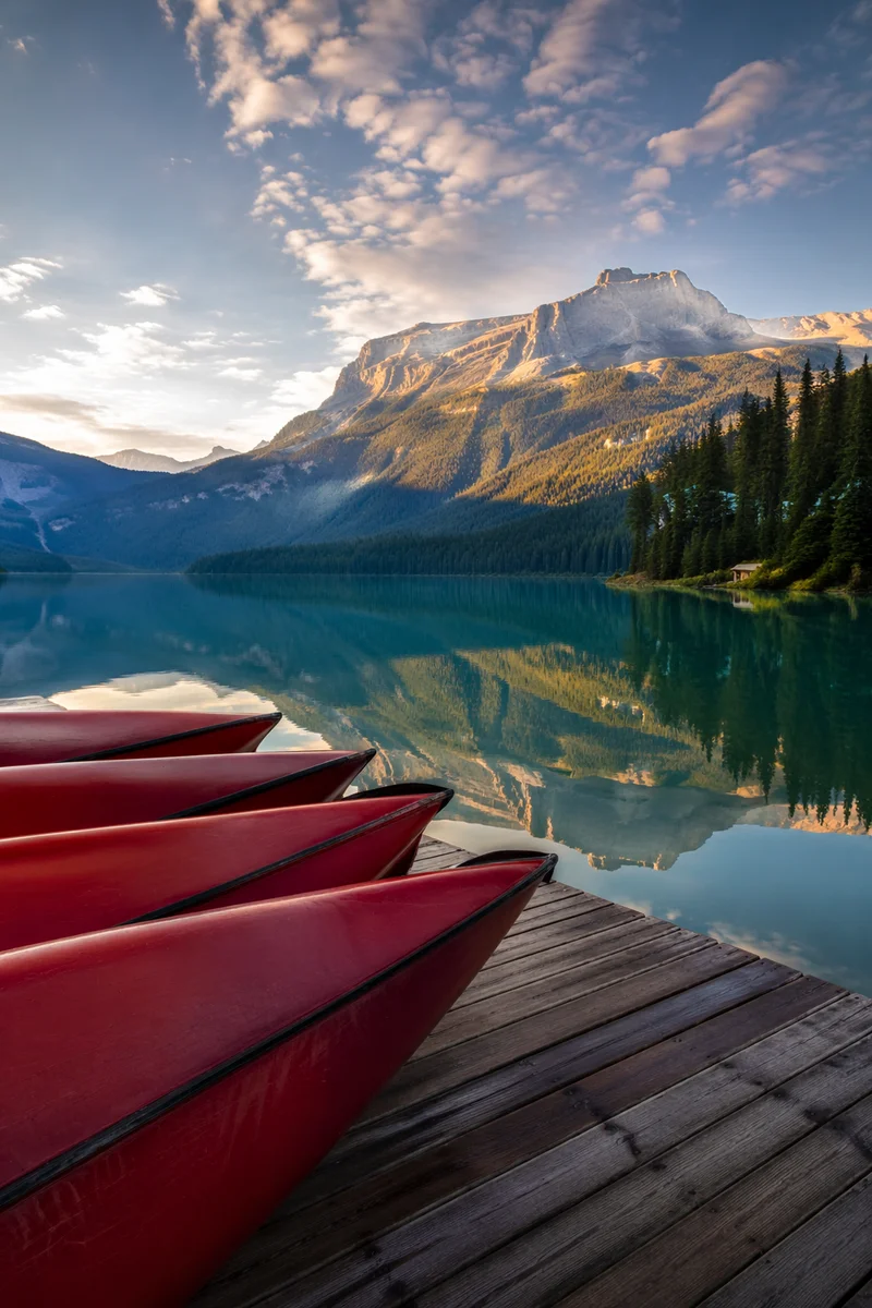 Peaceful Mountain Lake Canoes at Sunrise