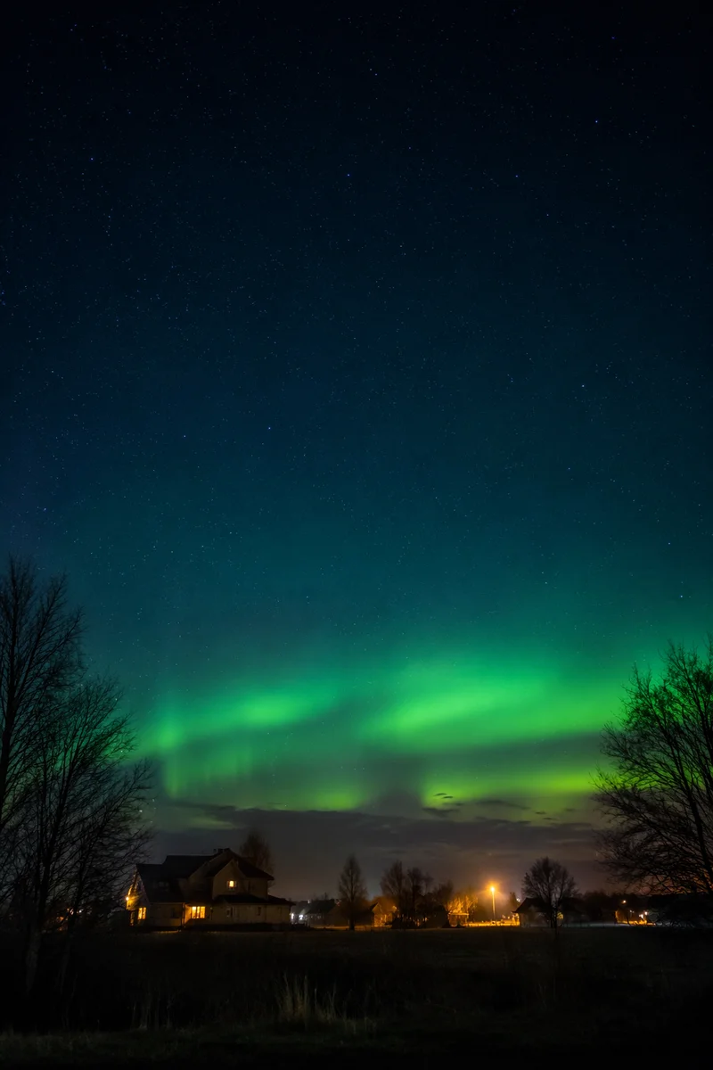 Emerald Aurora Over Quiet Northern Village
