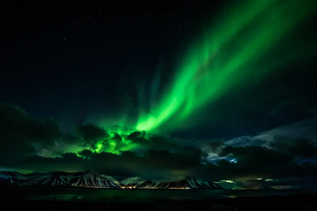 Green Aurora Over Arctic Mountain Horizon