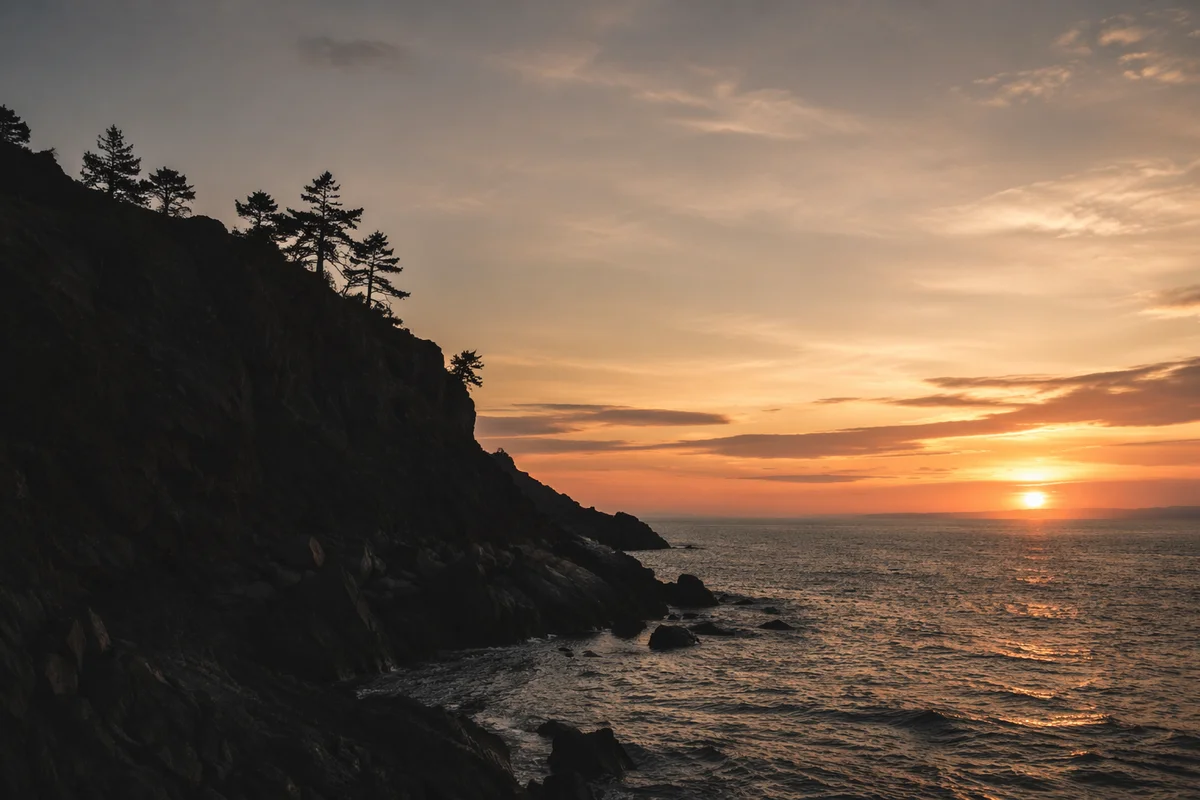 Moody Ocean Sunset with Rugged Cliffs