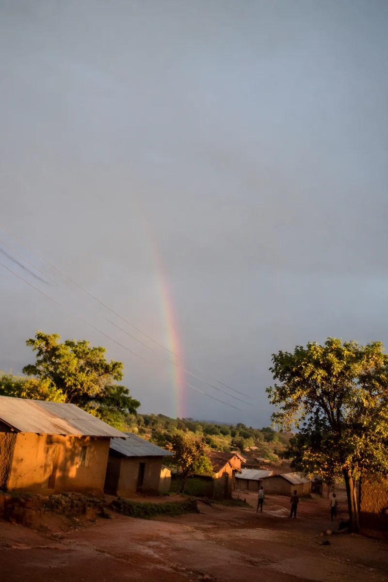 Faint Rainbow Over Rural Sky After Rain