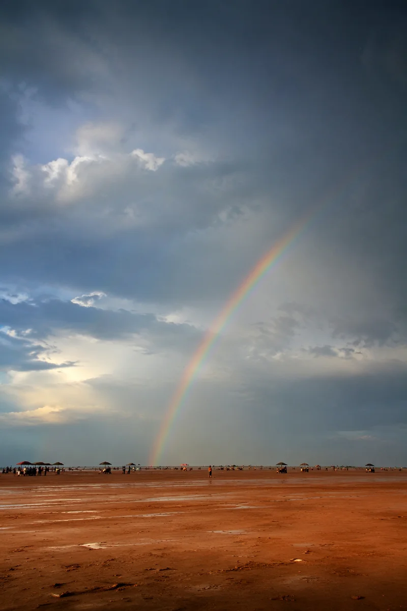 Rainbow Over Sandy Plain After Rain