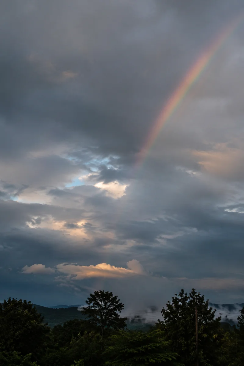 Soft Rainbow in Moody Evening Sky