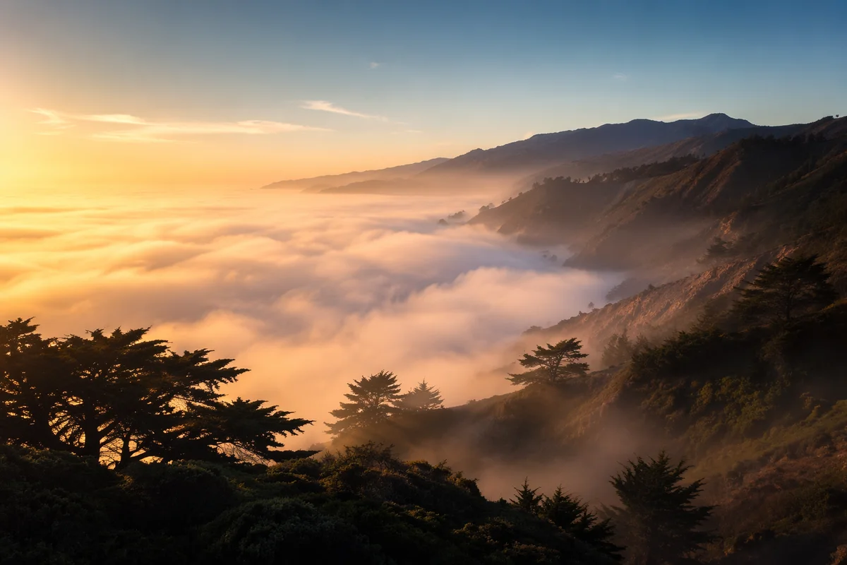 Sunrise Fog Over Rugged Coastal Cliffs