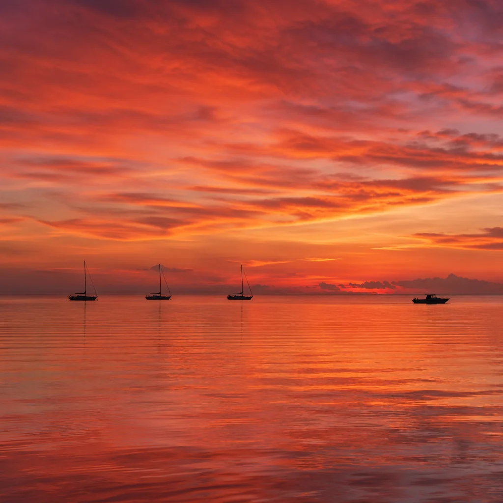 Peaceful Sailboats on Ocean Sunset Horizon