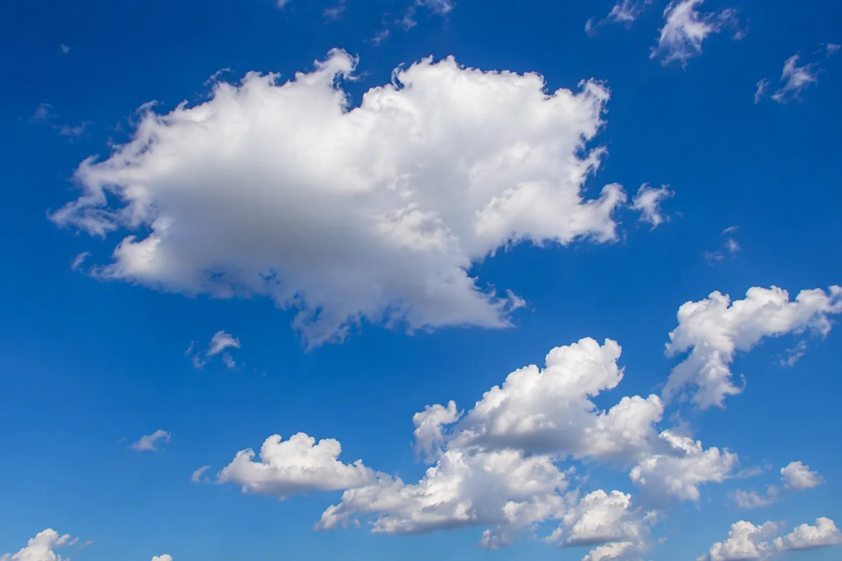Sunny Blue Sky With White Clouds