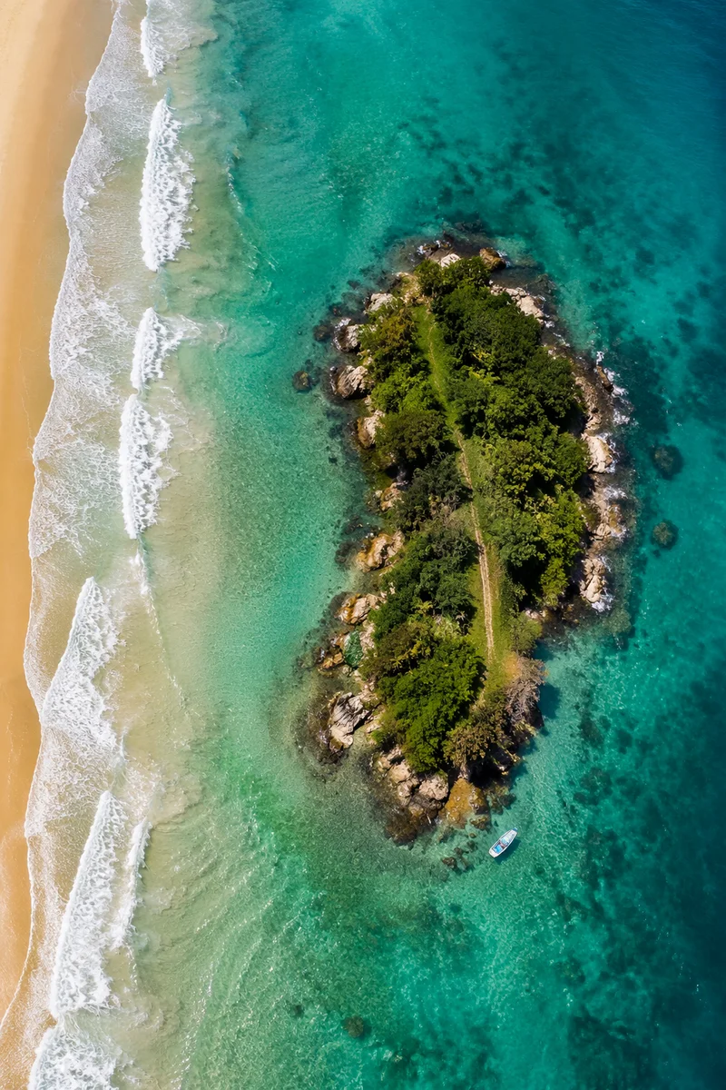 Aerial Tropical Islet in Turquoise Water