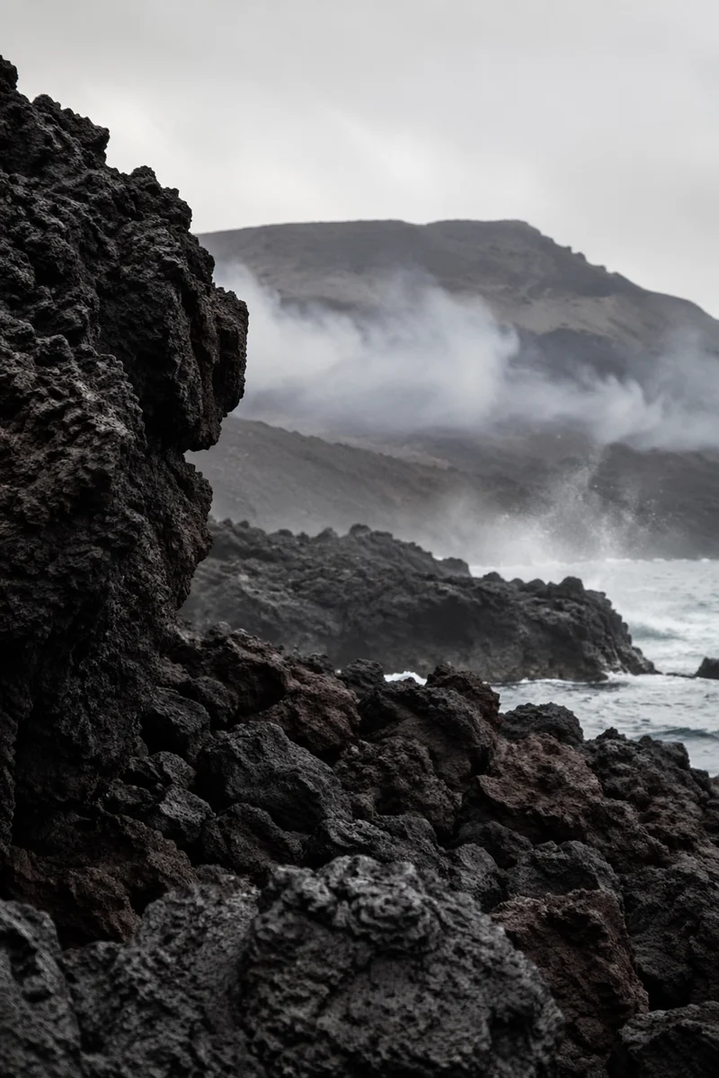 Moody Black Lava Coastline and Misty Ridge