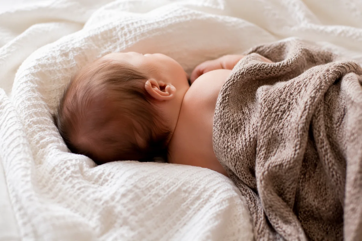 Peaceful Sleeping Newborn on Cozy Blanket