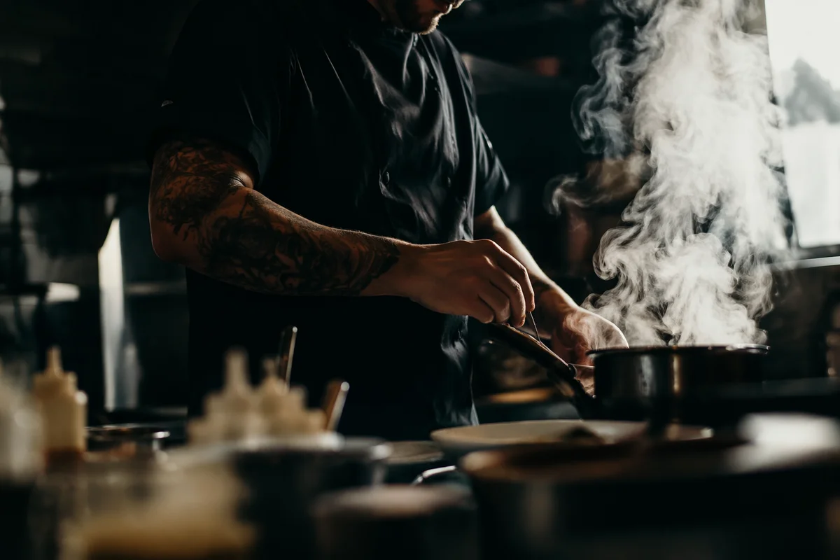 Chef Preparing Food in Moody Kitchen