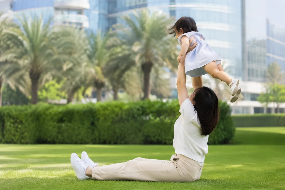 Happy Parent and Toddler Playing in Park