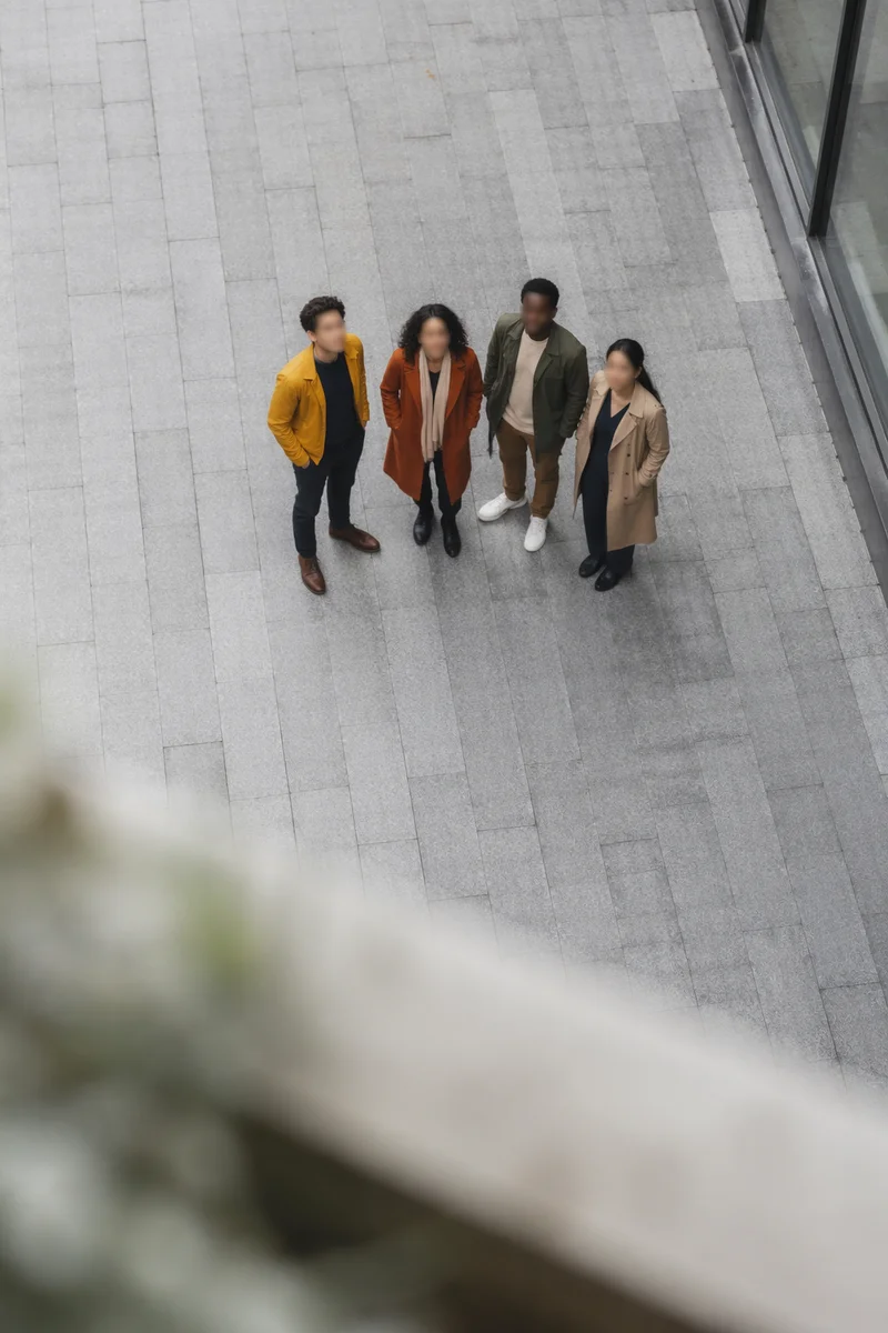 Multicultural Friends Looking Up in Courtyard