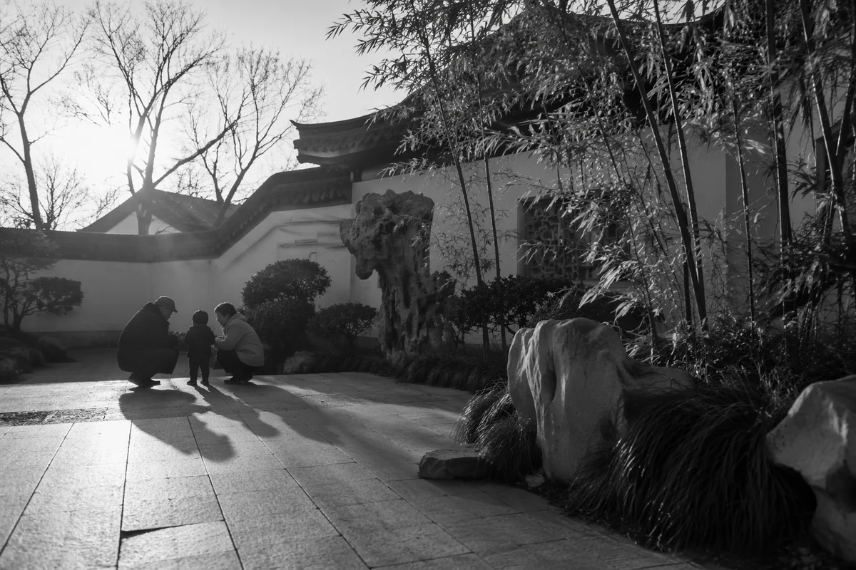 Grandparents and Grandchild in Peaceful Garden