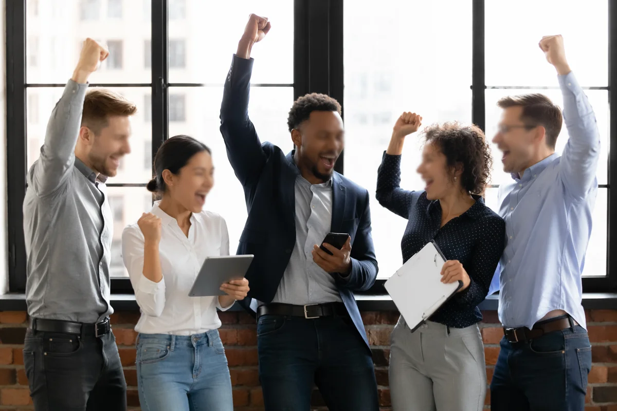 Coworkers Celebrating Team Success in Modern Office