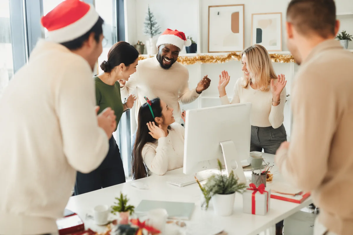 Coworkers Celebrating Holiday Moment in Bright Office