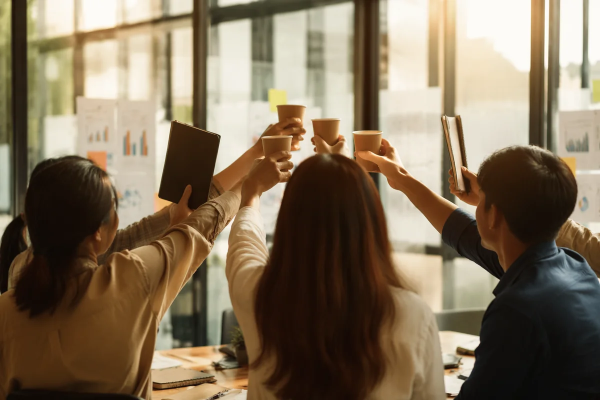 Coworkers Celebrating Team Milestone in Office