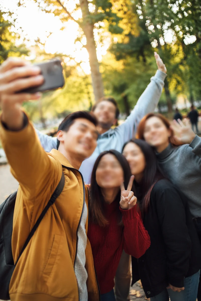 Cheerful Friends Group Selfie in Park