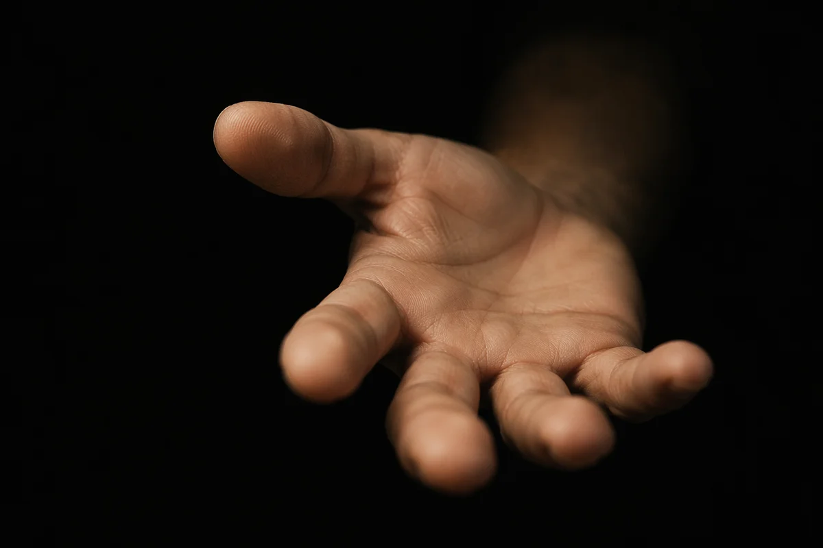 Close-Up Hand Reaching in Darkness