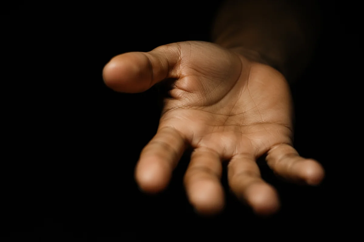Reaching Hand in Dark Cinematic Close-Up