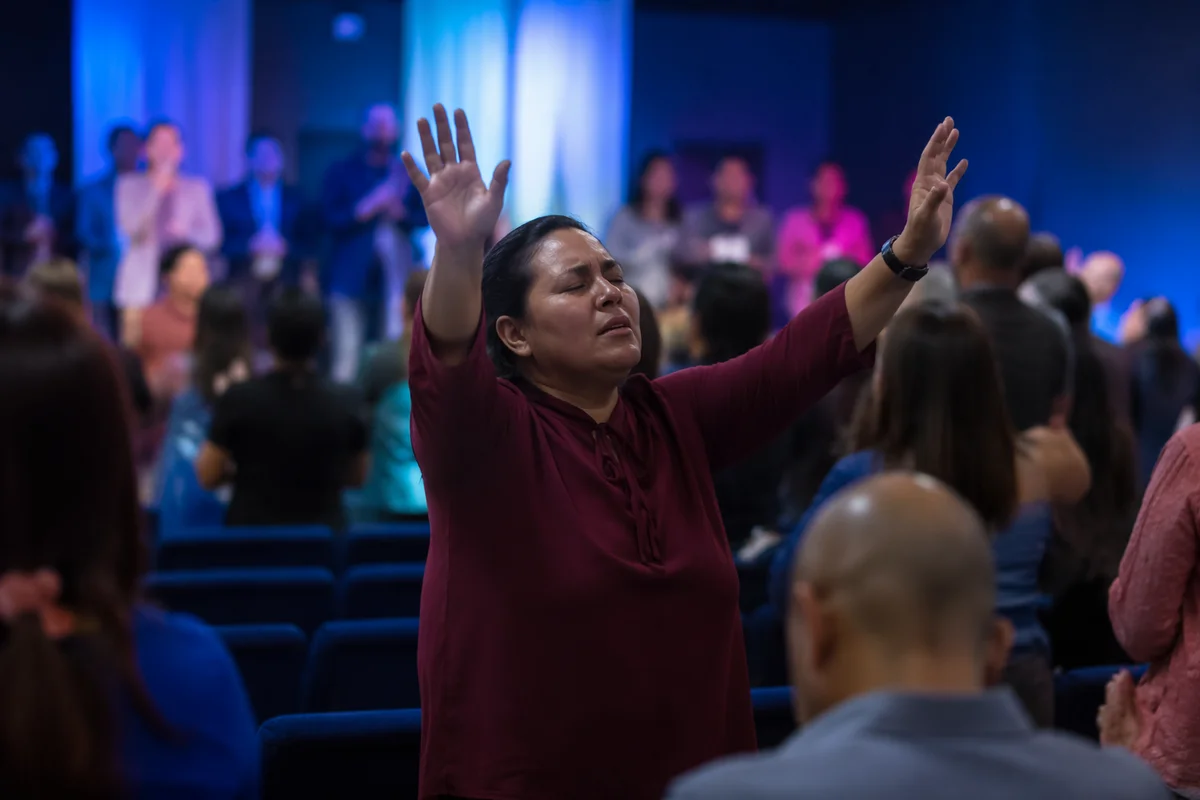 Hands Raised in Community Worship Service