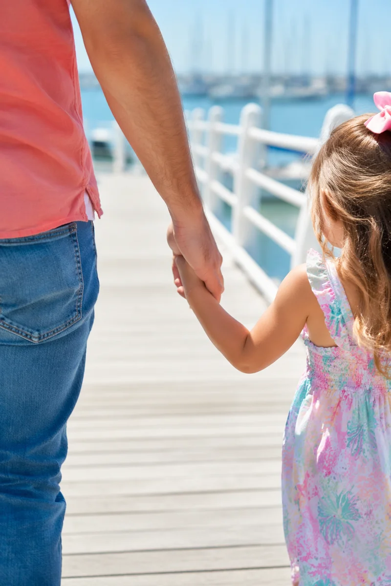 Parent and Child Walking Hand in Hand