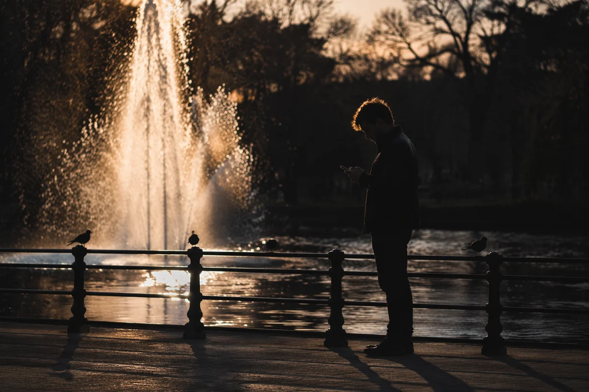 Solitary Silhouette by Sunset Fountain