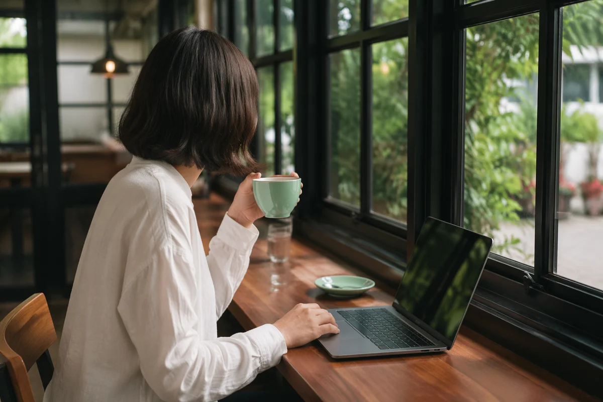 Focused Laptop Work in Quiet Cafe