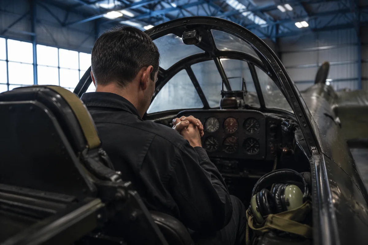 Pilot Praying Quietly in Cockpit Before Flight