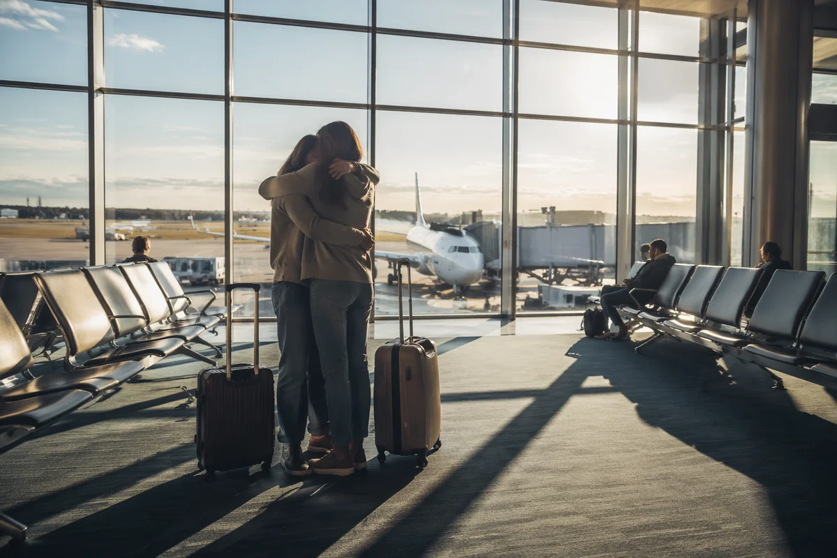 Sibling Reunion Hug at Airport Arrival