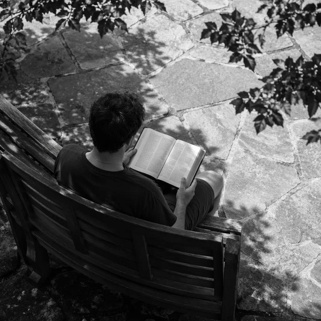 Young Adult Reading Bible on Park Bench