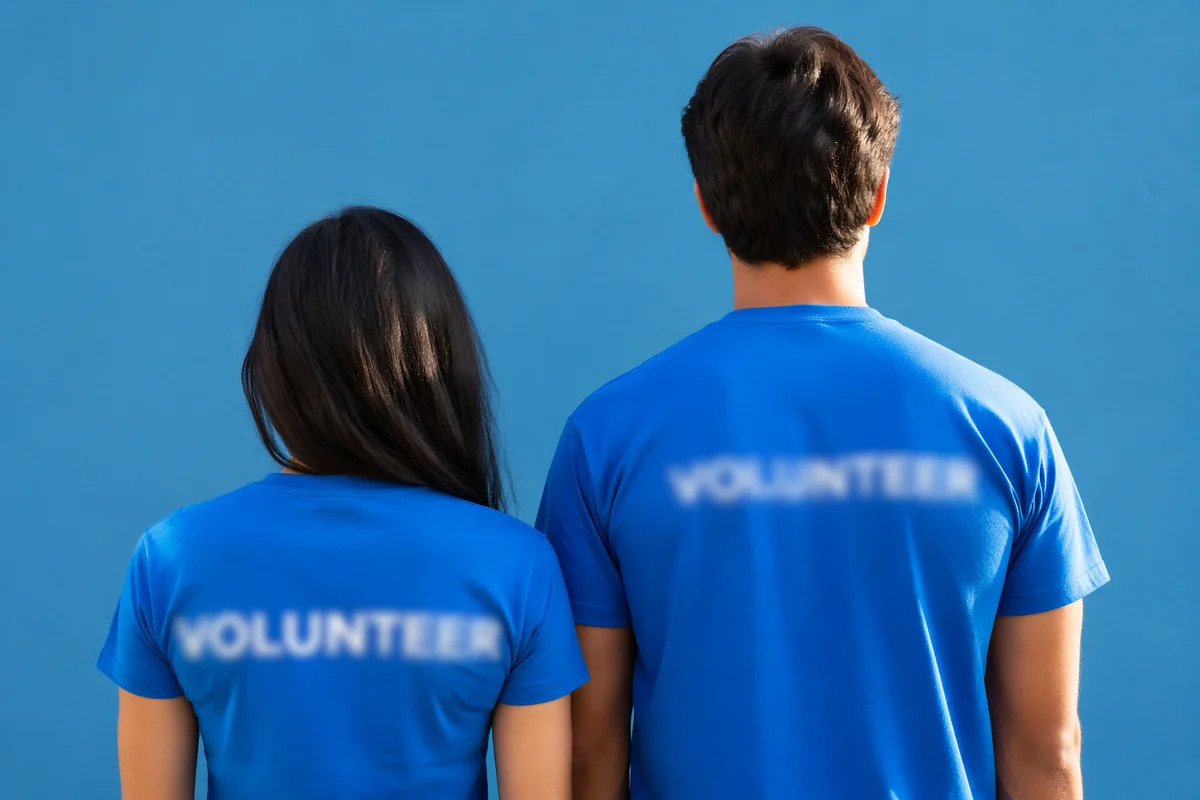 Community Volunteers in Matching Blue Shirts