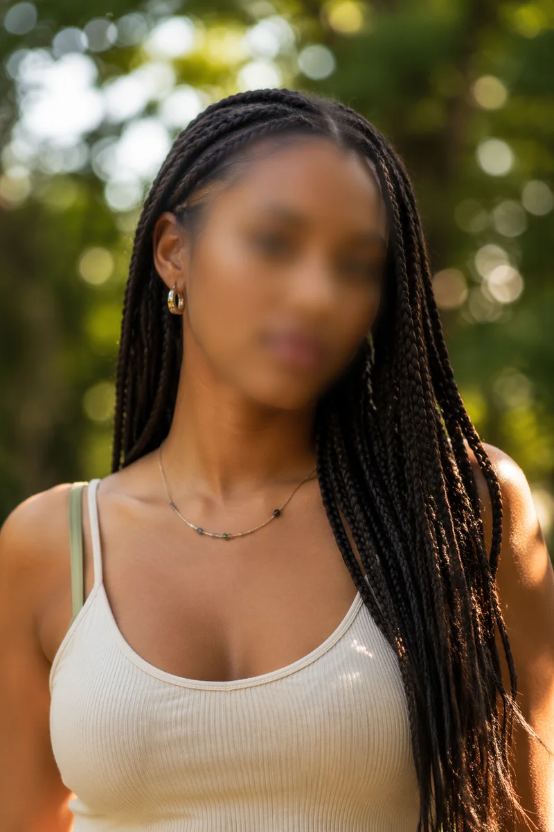 Confident Woman Portrait in Sunlit Park
