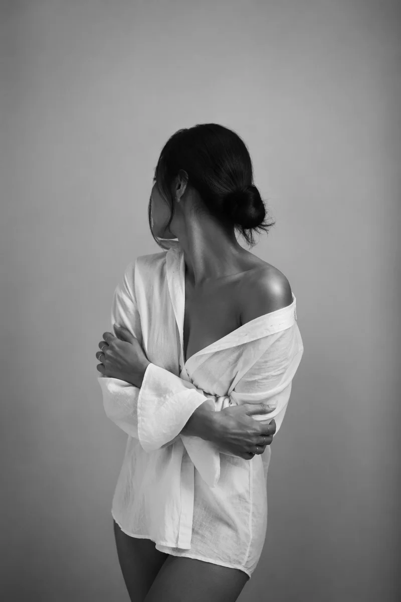 Confident Woman Portrait in Soft Gray
