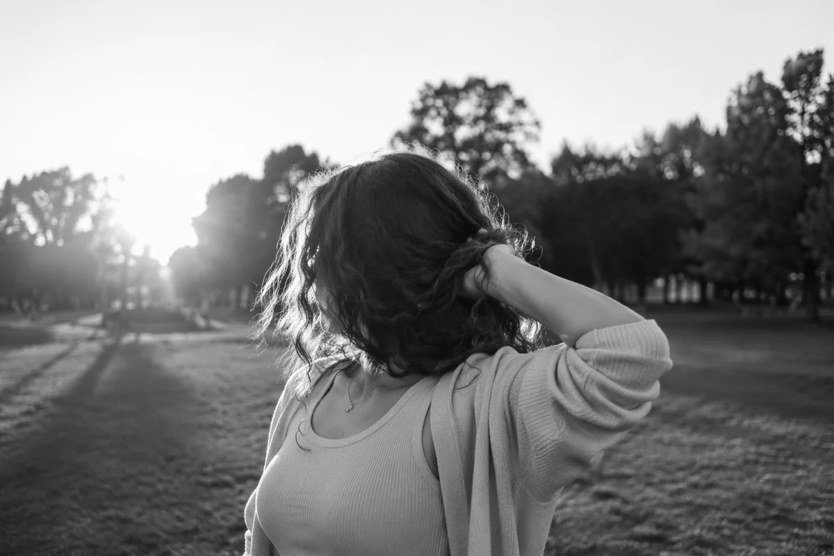Confident Woman Portrait in Evening Park