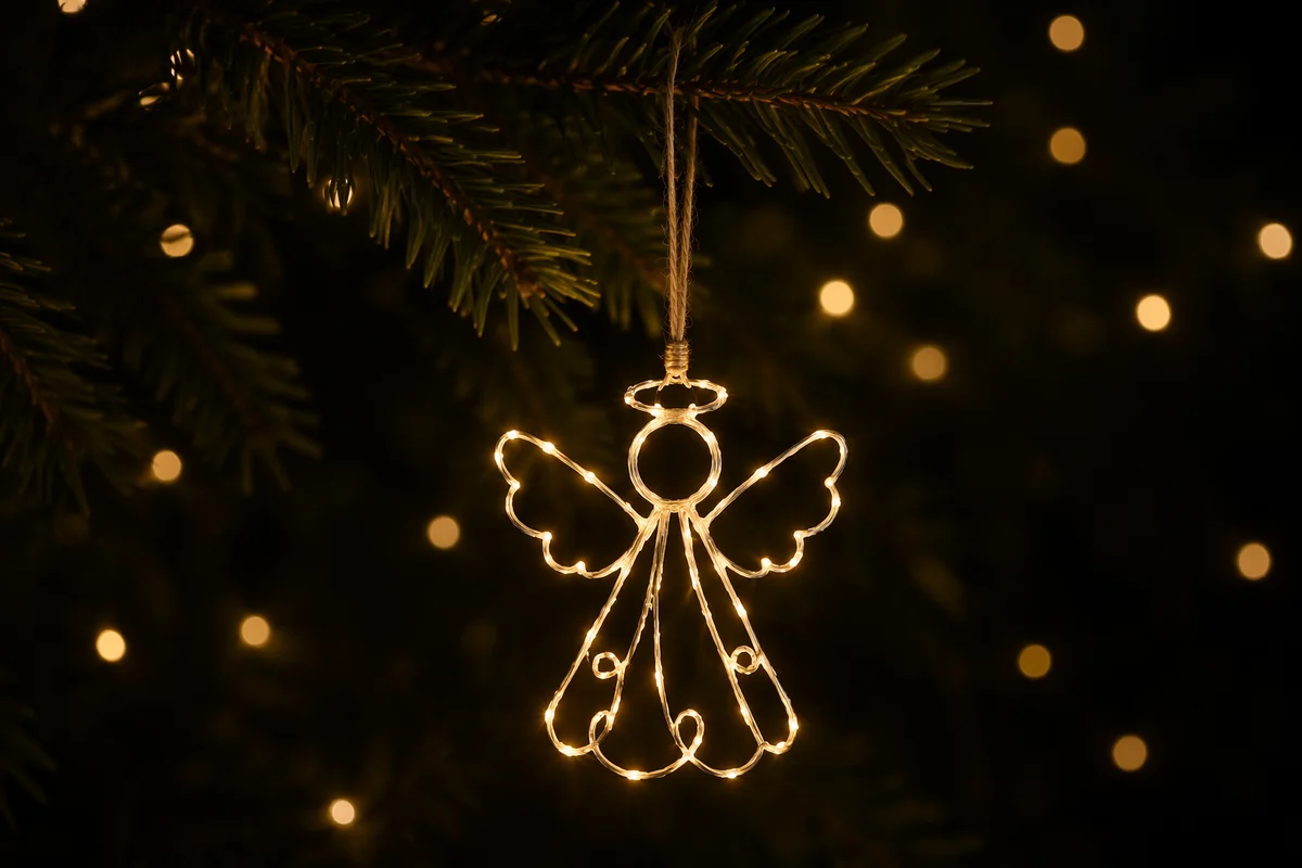 Glowing Angel Ornament on Christmas Evergreen