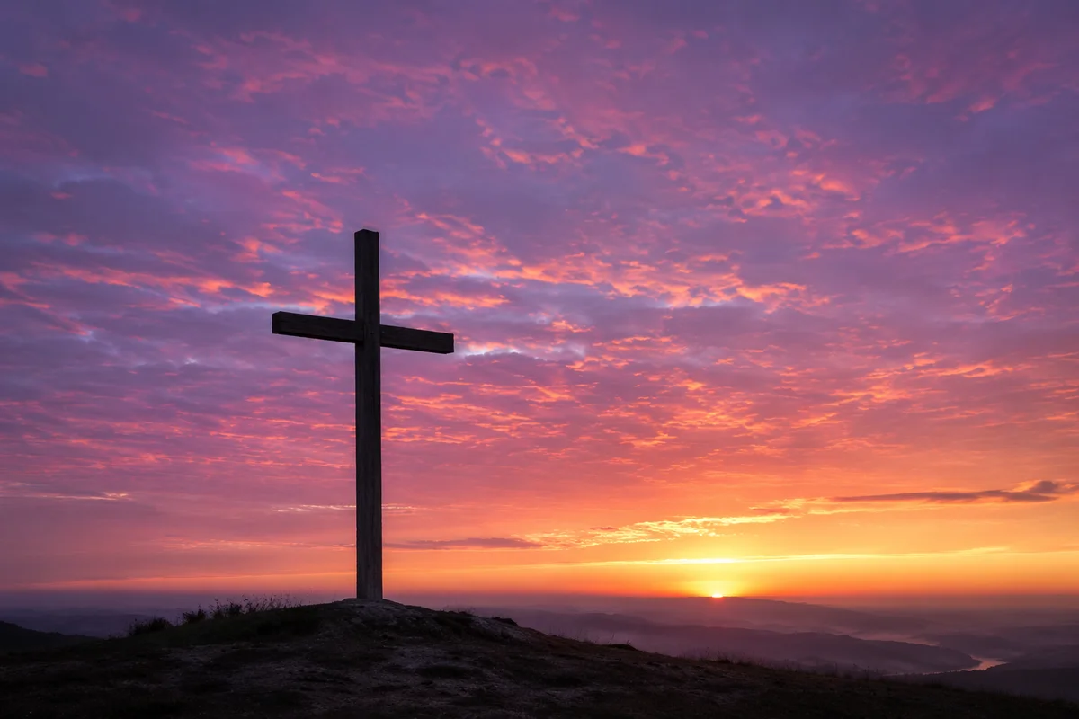 Easter Cross Silhouette at Dramatic Sunrise