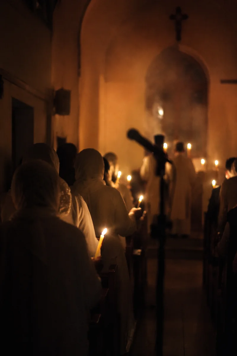 Easter Vigil Candlelight in Dark Chapel