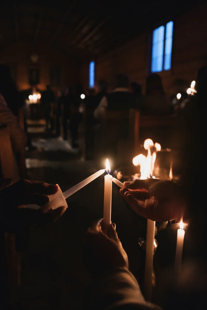 Easter Vigil Candle Lighting in Dark Chapel