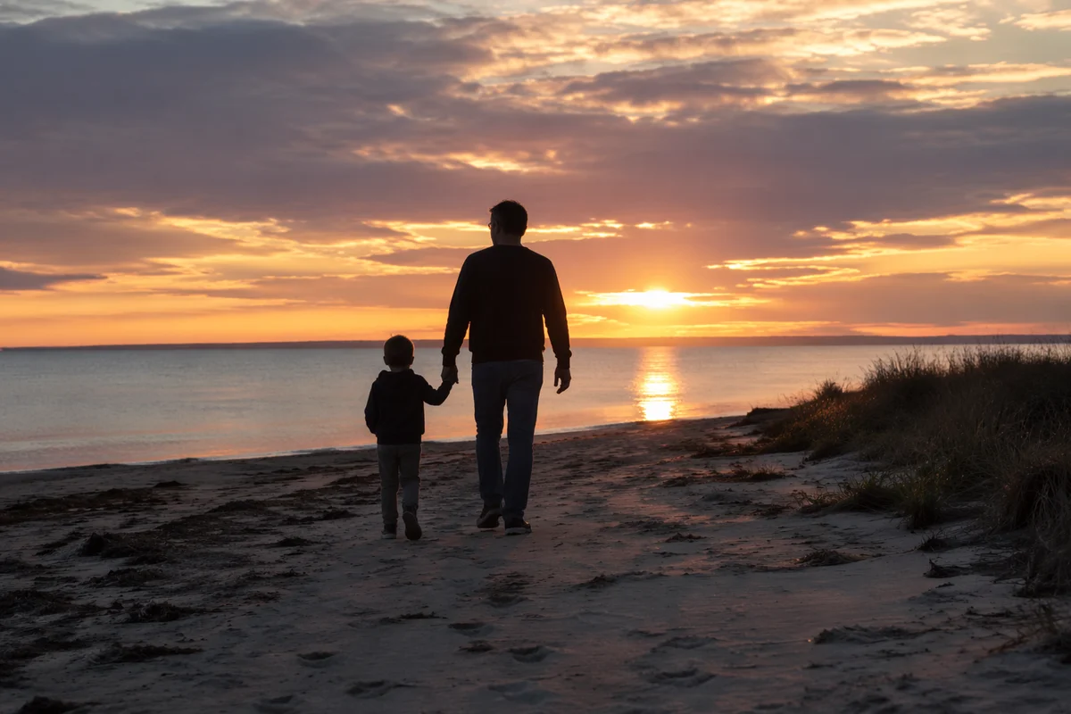 Father and Child Sunset Coastal Walk