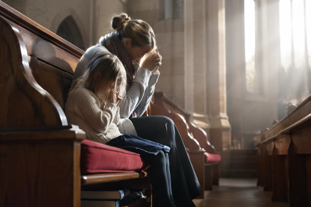 Mother and Child Praying in Winter Light
